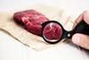 Fresh,Raw,Beef,Steak,With,A,Magnifier,On,Paper