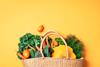 Straw,Basket,With,Organic,Vegetables,Over,Trendy,Yellow,Background.,Healthy