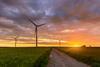 Windmills,For,Electric,Power,Production,At,Sunset,Time.,Poland,,Europe