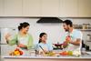 Joyful,Indian,Father,Mother,And,Kid,Dancing,Together,At,Kitchen