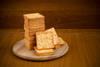 Fresh,Baked,Cream,Crackers,In,Stacks,Over,Wooden,Cutting,Circle