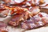 Crispy,Cooked,Bacon,On,Wooden,Table,,Close,Up