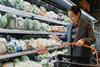 Woman,Selecting,Fresh,Produce,At,Grocery,Store