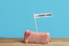 Sample,Of,Lab,Grown,Pork,Labeled,Cultured,Meat,On,Wooden
