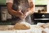 Chef's,Hands,Spraying,Flour,Over,The,Dough.,Kneading,Dough.,Male