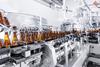 Process,Pasteurization,Brown,Glasses,Bottles,With,Beer,,Moving,On,Conveyor.