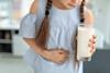 Little,Girl,With,Dairy,Allergy,Holding,Glass,Of,Milk,Indoors