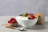 Tasty,Granola,With,Berries,And,Yogurt,In,Bowl,On,Grey
