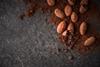 Cacao,Beans,And,Cacao,Powder,On,Dark,Background