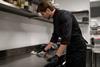 Chef,Cleaning,Kitchen,Counter,After,Cooking,In,Restaurant