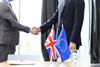 European,Union,And,United,Kingdom,Leaders,Shaking,Hands,On,A