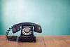 Retro,Telephone,On,Table,In,Front,Mint,Green,Background