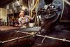 A,Female,Coffee,Factory,Worker,Using,Coffee,Roasting,Machine.