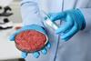 Scientist,Holding,Petri,Dish,With,Minced,Cultured,Meat,In,Laboratory,