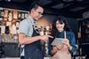 Asian,Barista,Owner,Training,Staff,Using,Technology,On,Tablet,Take