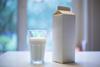 Carton,Box,And,Glass,Of,Milk,On,Table,In,Kitchen