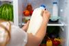 Female,Hand,Taking,Bottle,Of,Milk,From,A,Fridge