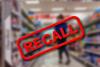 Blurry,Interior,Of,A,Grocery,Store,Aisle,Behind,Large,Red