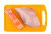 Piece,Of,Salmon,And,Raw,Chicken,Breast,On,Orange,Plastic