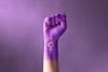 Raised,Purple,Fist,Of,A,Woman,For,International,Women's,Day