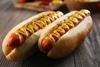 Hot,Dogs,On,Wooden,Background,Closeup
