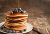 Stack,Of,Pancakes,With,Fresh,Blueberry,And,Maple,Syrup