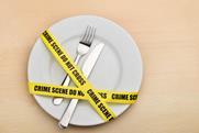 Dangerous,Food.,Empty,Plate,,Fork,And,Knife,Wrapped,In,Crime
