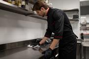 Chef,Cleaning,Kitchen,Counter,After,Cooking,In,Restaurant