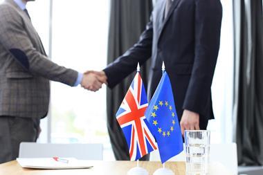 European,Union,And,United,Kingdom,Leaders,Shaking,Hands,On,A