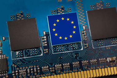 European,Union,Flag,In,The,Center,Of,A,Circuit,Board.