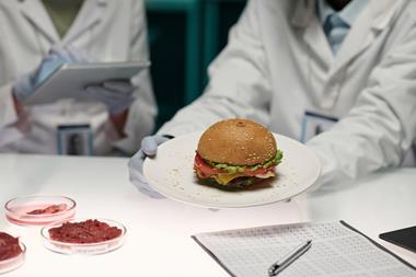 Unrecognizable,Lab,Worker,Holding,Plate,With,Artificial,Meat,Hamburger