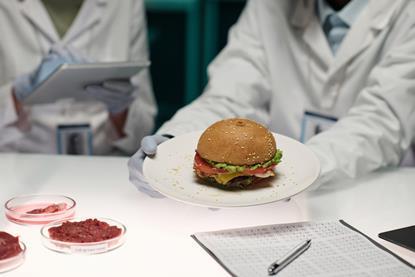 Unrecognizable,Lab,Worker,Holding,Plate,With,Artificial,Meat,Hamburger