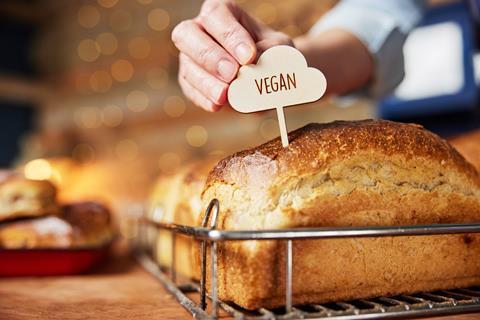 Sales,Assistant,In,Bakery,Putting,Vegan,Label,Into,Freshly,Baked