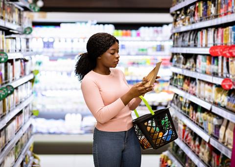 Beautiful,African,American,Woman,Making,Choice,Of,Products,At,Supermarket.