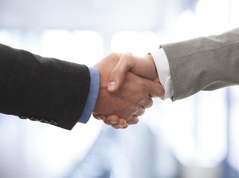 Two,Business,Men,Shaking,Hands