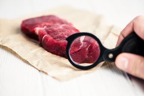 Fresh,Raw,Beef,Steak,With,A,Magnifier,On,Paper