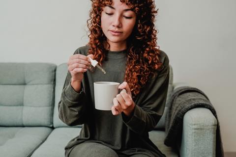 Cbd,Hemp,Oil,-,Woman,Taking,Cannabis,Oil,In,Tea