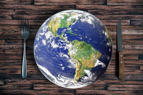 The,Planet,Earth,Plate,With,A,Fork,And,Knife,On