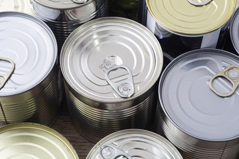 Tin,Silver,Cans,For,Tinned,Food,On,Wooden,Background