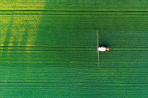 Aerial,View,Of,A,Tractor,Spraying,Agricultural,Fields.,Spraying,Herbicides