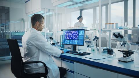 Medical,Science,Laboratory:,Microbiologist,Working,On,Computer,With,Display,Showing