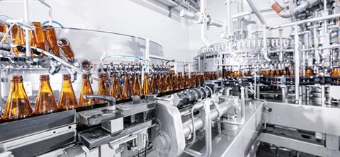 Process,Pasteurization,Brown,Glasses,Bottles,With,Beer,,Moving,On,Conveyor.