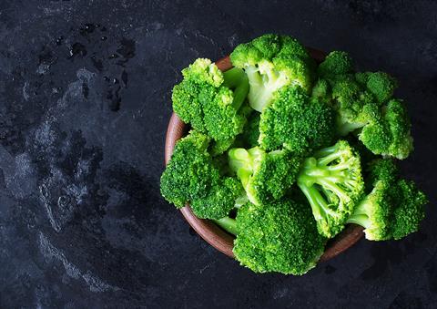 Fresh,Raw,Broccoli,In,A,Wooden,Bowl,On,A,Dark