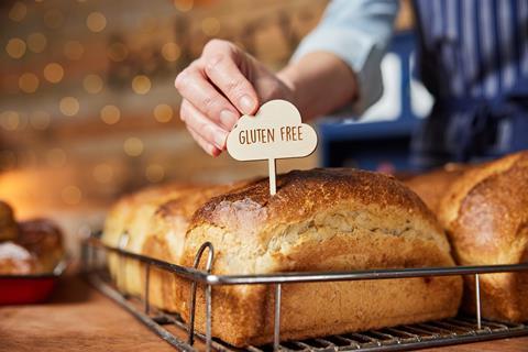 Sales,Assistant,In,Bakery,Putting,Gluten,Free,Label,Into,Freshly