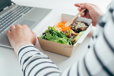Woman,Having,Lunch,From,Recycled,Bowl,And,Using,Laptop.,Concept