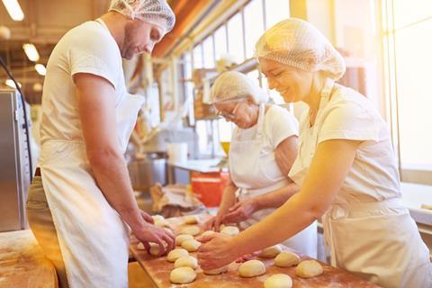 Bakers,Bake,Small,Rolls,Together,In,Bakery,As,A,Family