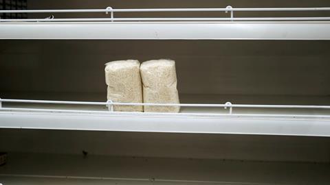 Last,Packages,Of,Rise,On,The,Empty,Shelf,In,A