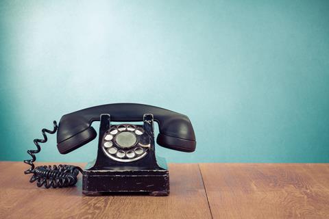 Retro,Telephone,On,Table,In,Front,Mint,Green,Background