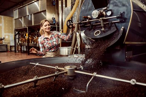 A,Female,Coffee,Factory,Worker,Using,Coffee,Roasting,Machine.