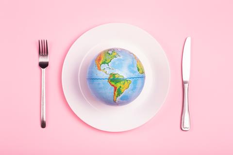 Globe,On,A,Plate,For,Food,On,A,Pink,Background.
